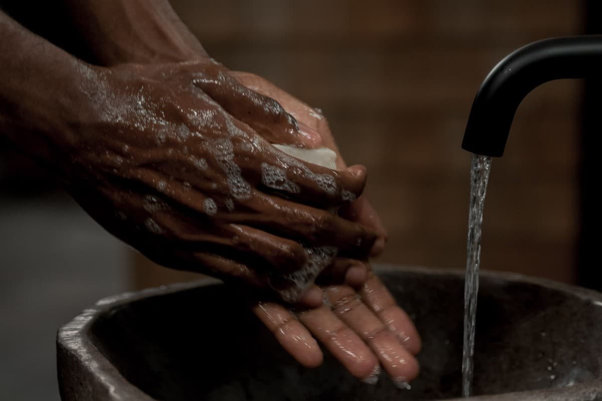 A person washing their hands